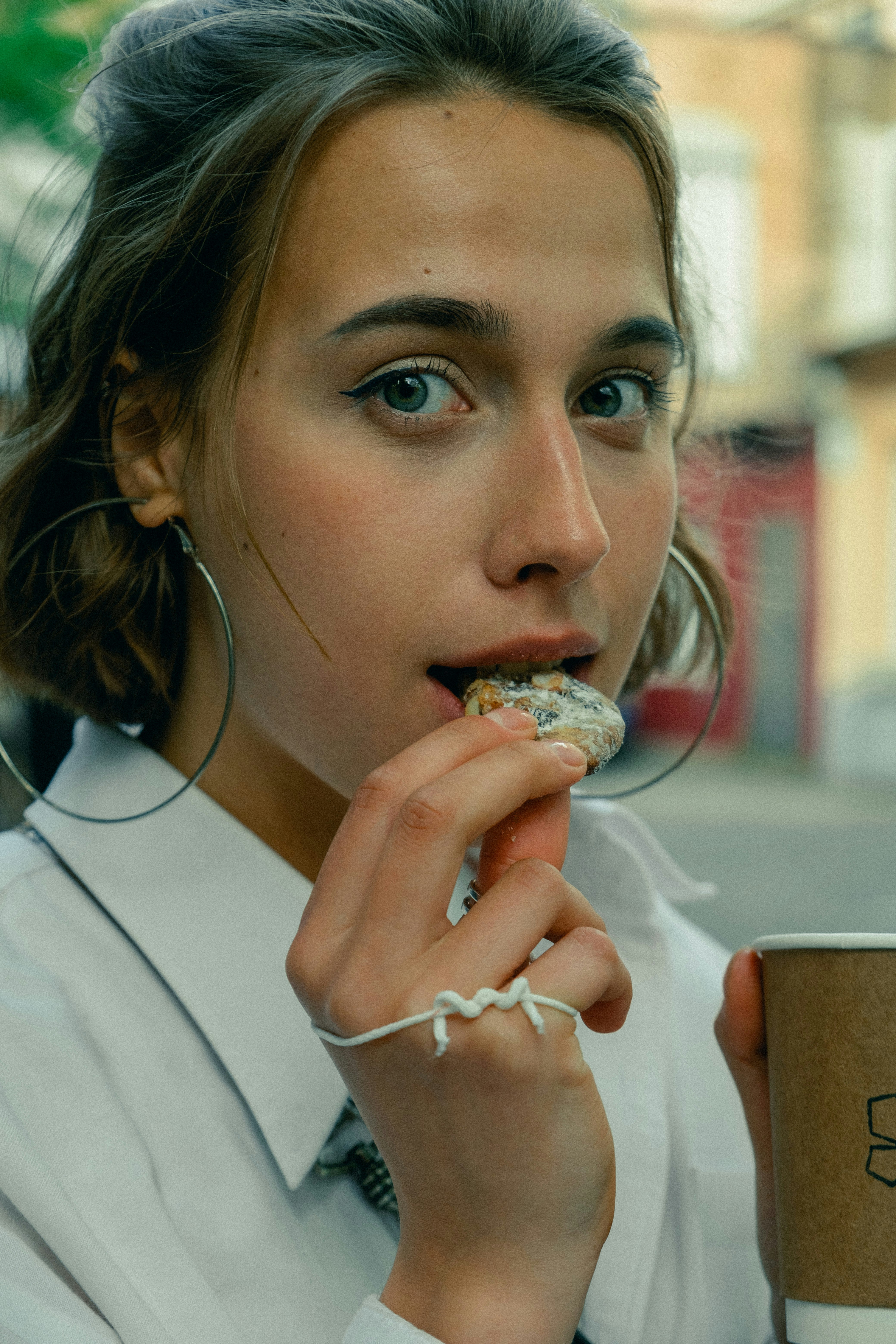 girl in white shirt eating ice cream